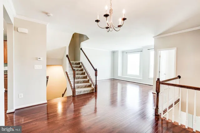 a view of an entryway with wooden floor