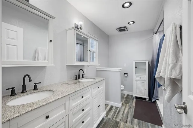 a bathroom with a sink double vanity and a mirror