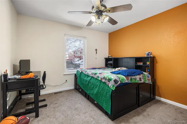 a bedroom with a bed and a table