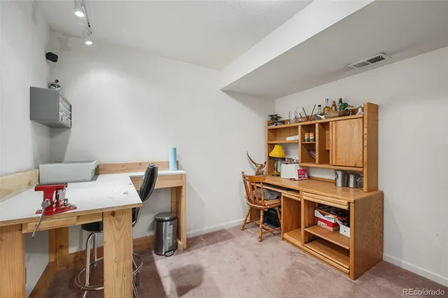 a view of a balcony dining area with furniture