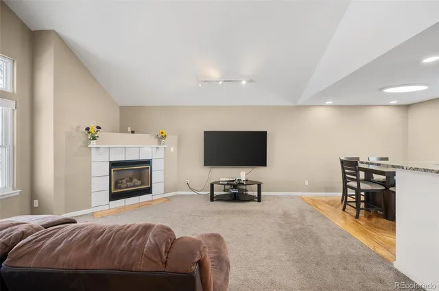 a bedroom with a bed and a flat screen tv with dresser
