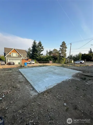 a view of a town with big trees and a big yard