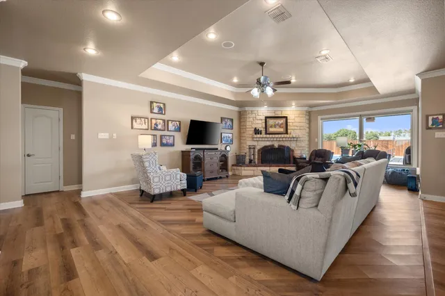 a living room with furniture and a fireplace