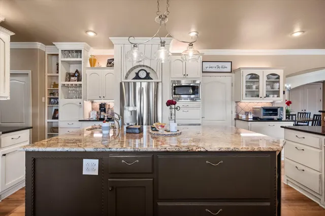 a en suite bathroom with a sink a mirror and a shower