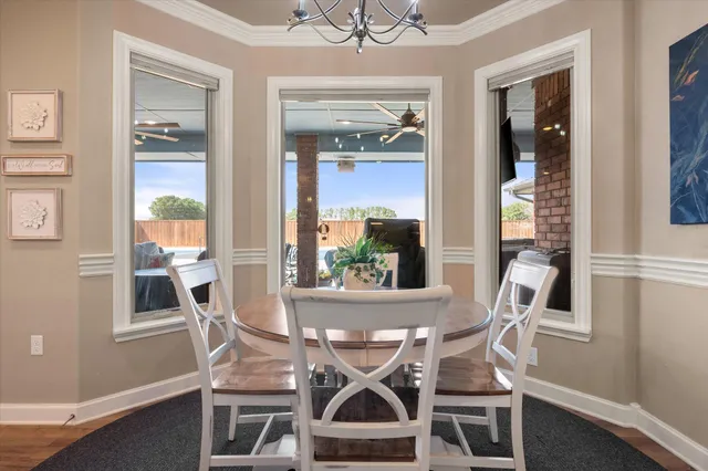 a view of a hallway with closet and wooden floor