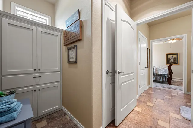 a large bathroom with a double vanity sink a mirror and a