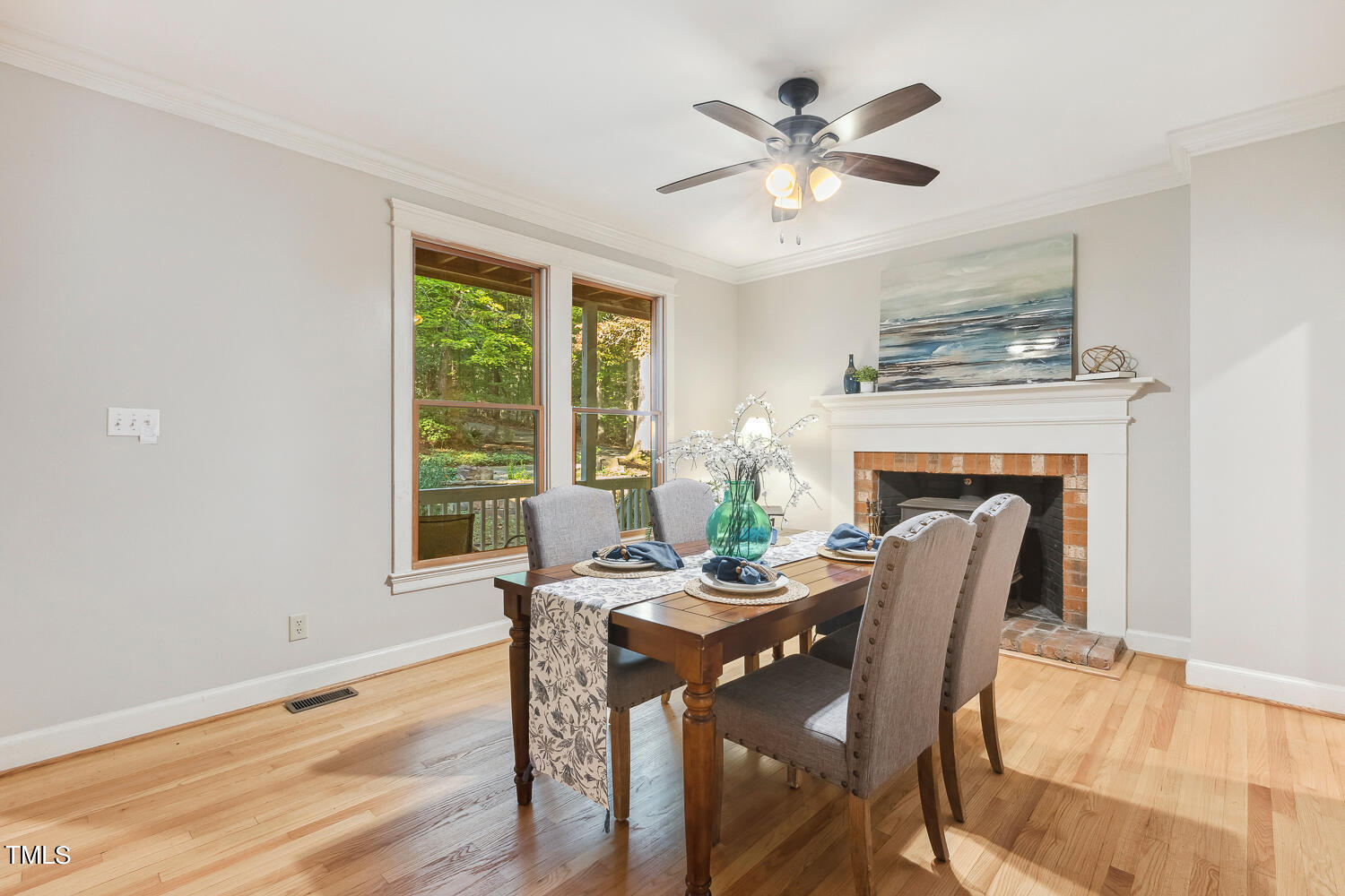 2012 Mt Vernon Church Road Raleigh, NC 27614 - Photo 12 of 71 a dining room with furniture a fireplace and wooden floor