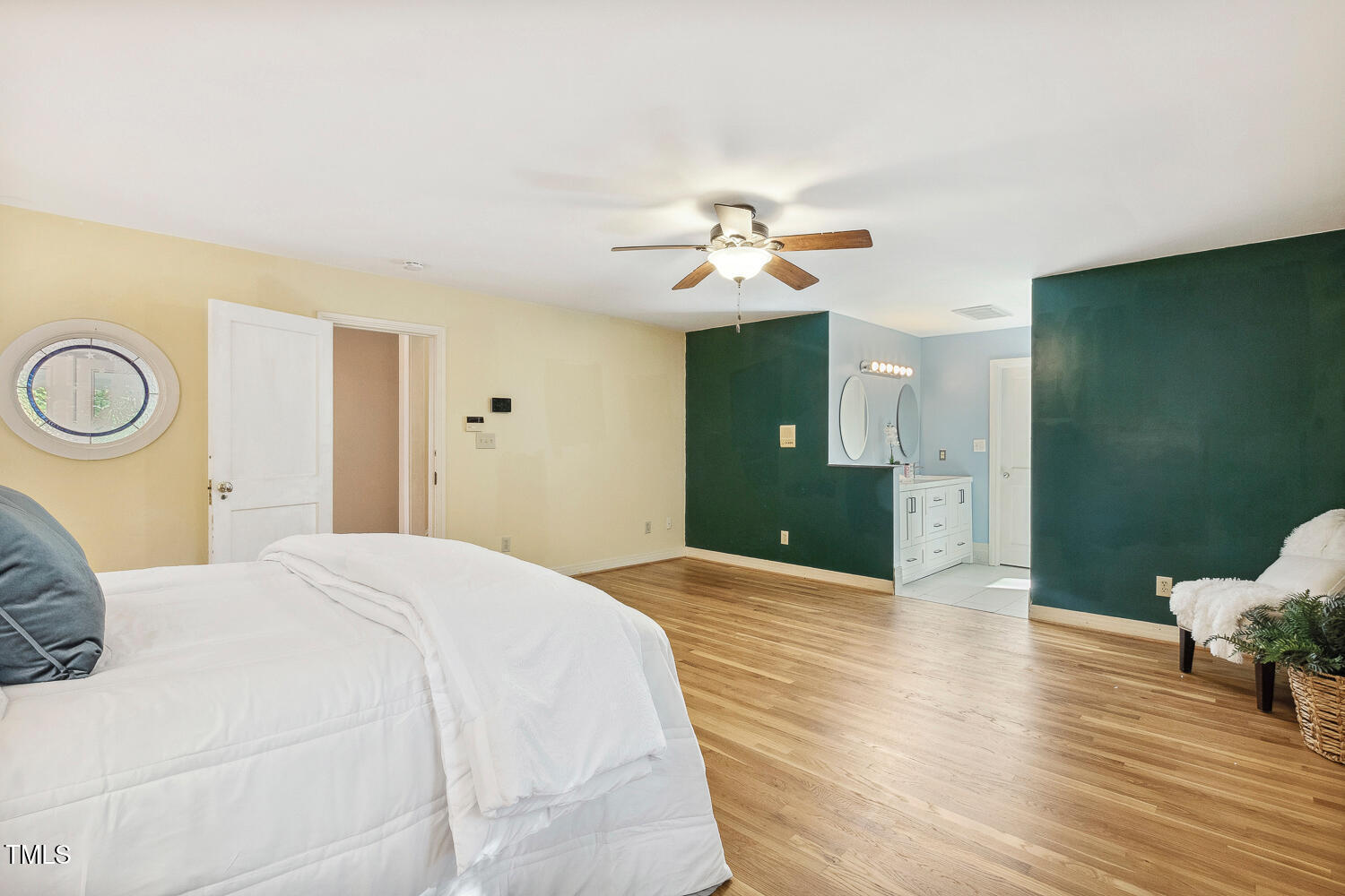 2012 Mt Vernon Church Road Raleigh, NC 27614 - Photo 30 of 71 a bedroom with a bed and a chandelier