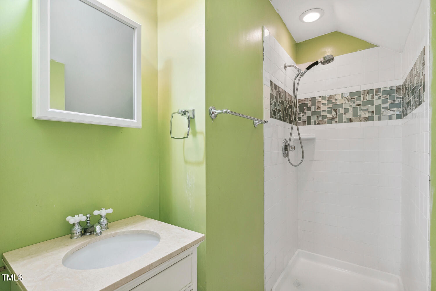 2012 Mt Vernon Church Road Raleigh, NC 27614 - Photo 48 of 71 a bathroom with a sink a mirror and a shower