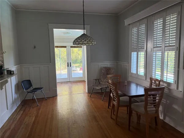 a kitchen with a sink appliances cabinets and a window