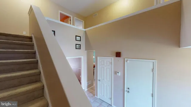 a living room with furniture and a toilet