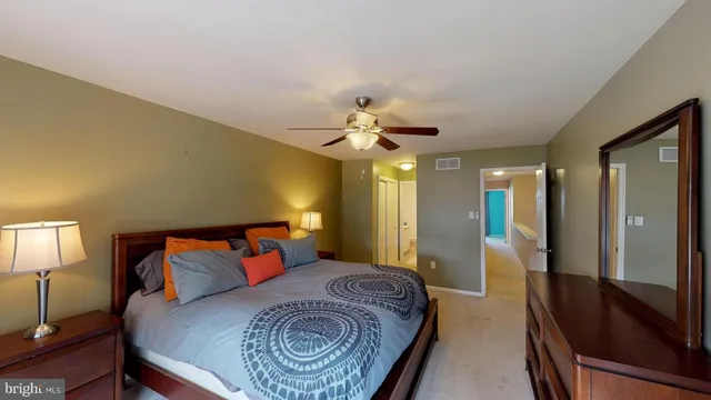a spacious bathroom with a tub shower and a sink