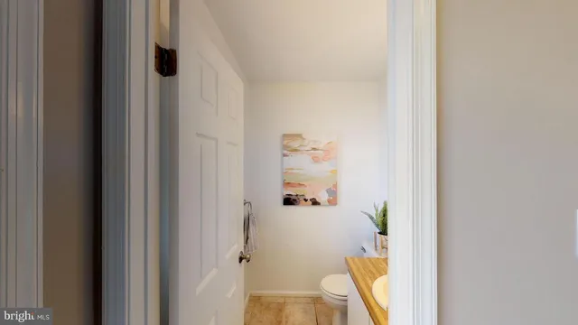 a bathroom with a sink mirror and vanity