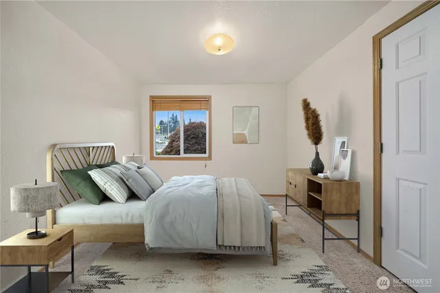 a bedroom with a bed and window