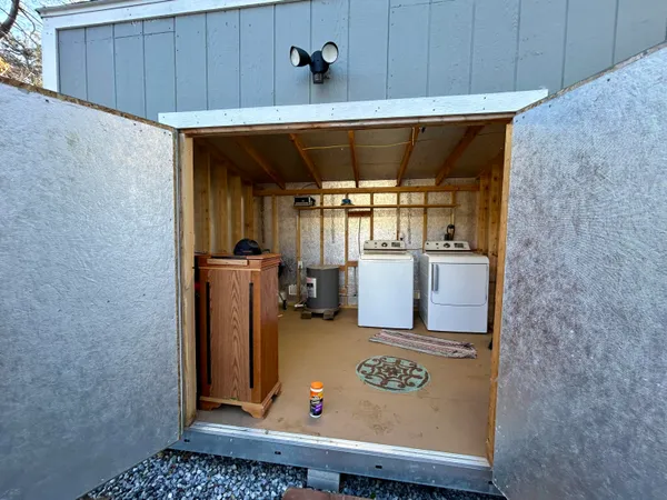 a view of a balcony with wooden floor