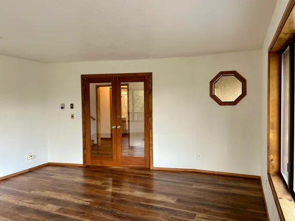 a large kitchen with granite countertop a sink and a counter top space
