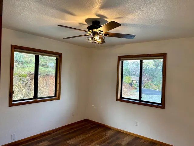 a kitchen with stainless steel appliances granite countertop a refrigerator and a stove