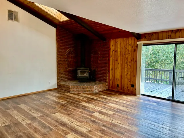 a kitchen with a refrigerator a sink and a window