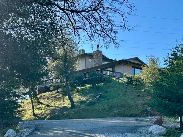a front view of a house with swimming pool