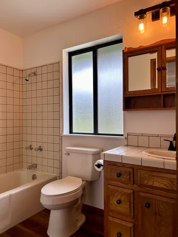 a kitchen with a stove a sink and a refrigerator