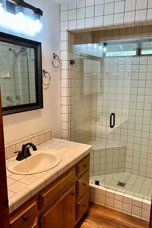 a bathroom with a sink toilet and bathtub