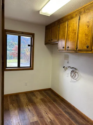 a living room with furniture a window and a fireplace