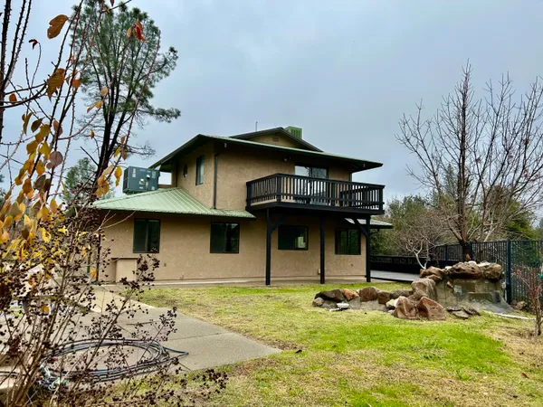a backyard of a house with lots of green space