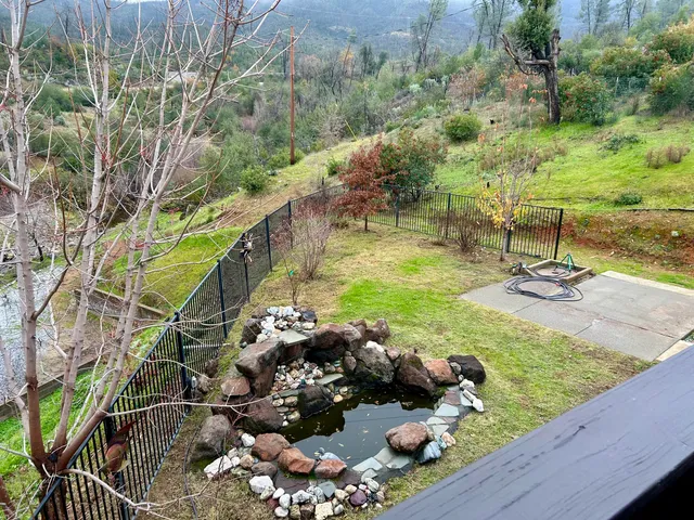 a view of a backyard of the house
