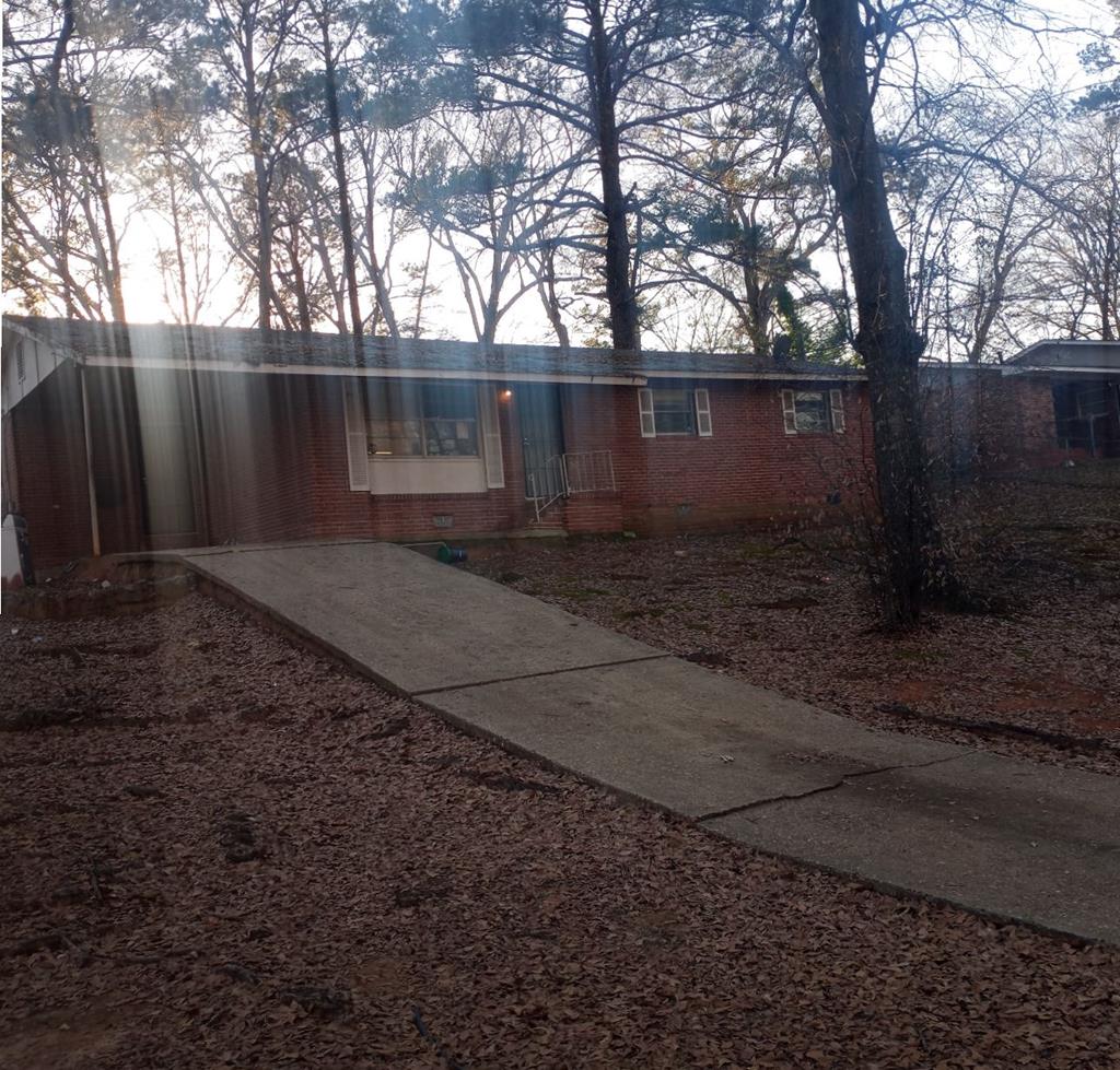 4250 Roman Drive Columbus, GA 31907 - Photo 1 of 1 a backyard of a house with lots of green space