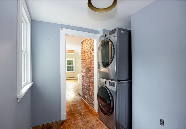 a view of a storage and utility room with washer and dryer