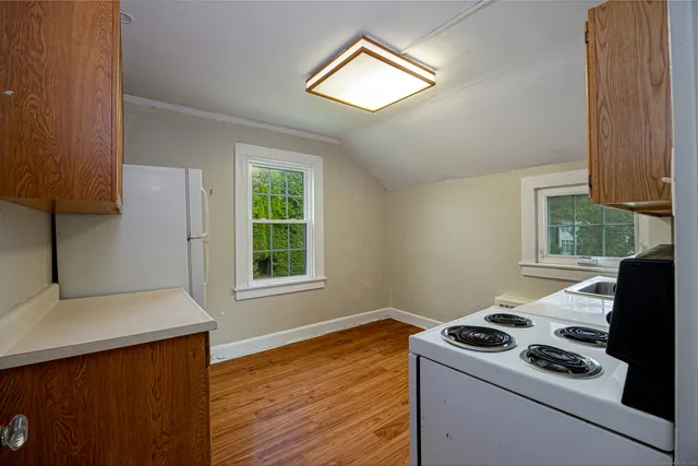 a room with a stove and a window