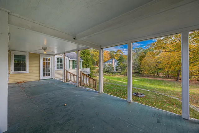 a view of a room with an empty space and balcony