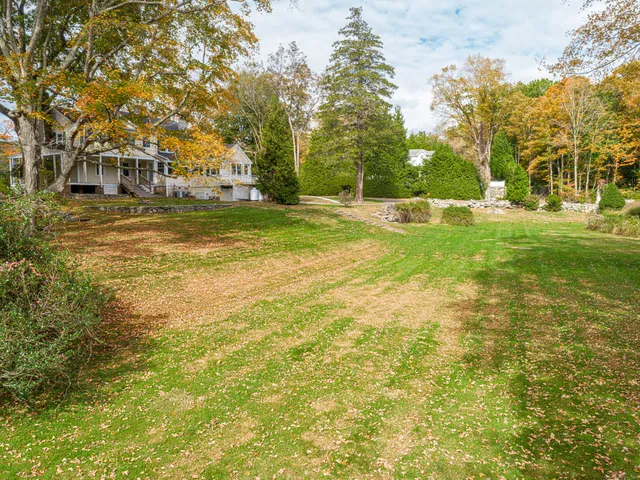 a view of yard with swimming pool