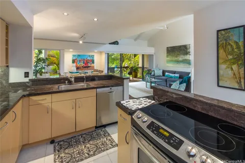 a kitchen with a stove a sink and a microwave