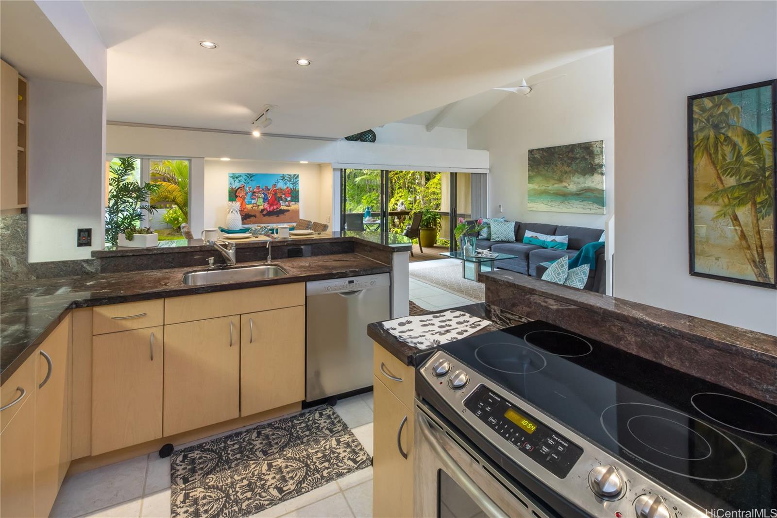 445 Kawailoa Road, Unit 4 Kailua, HI 96734 - Photo 6 of 23 a kitchen with a stove a sink and a microwave
