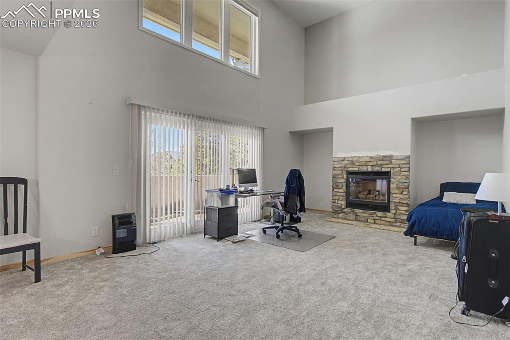 20 Luxury Lane Colorado Springs, CO 80921 - Photo 12 of 36 a living room with furniture and a fireplace