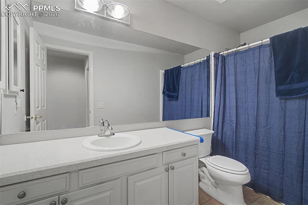 20 Luxury Lane Colorado Springs, CO 80921 - Photo 15 of 36 a bathroom with a sink a toilet and mirror