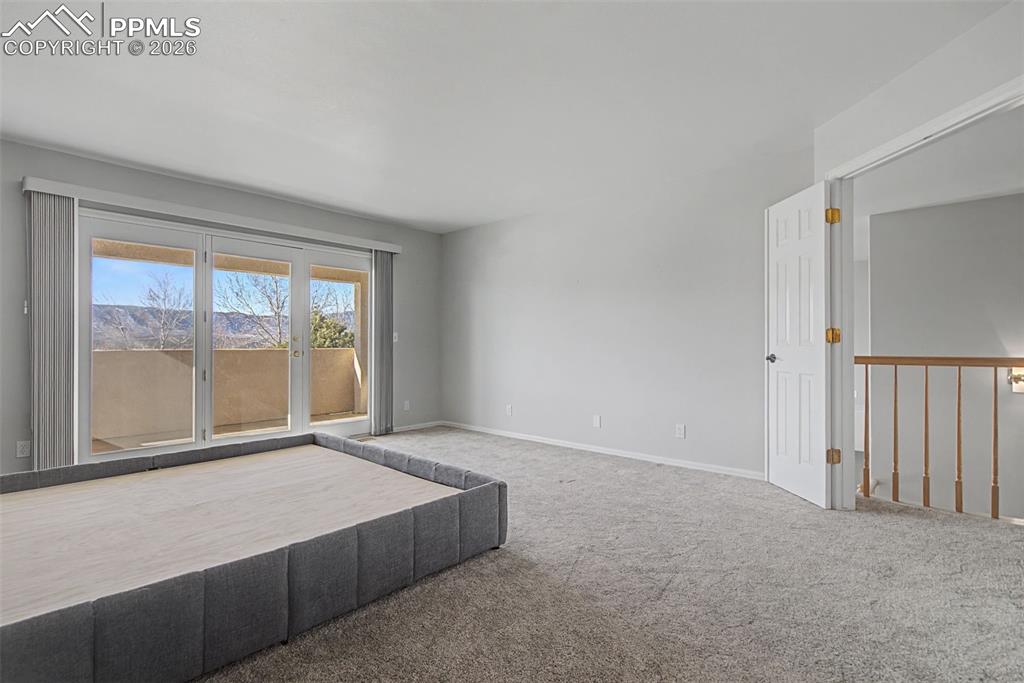 20 Luxury Lane Colorado Springs, CO 80921 - Photo 20 of 36 a large bed sitting in a room next to a window