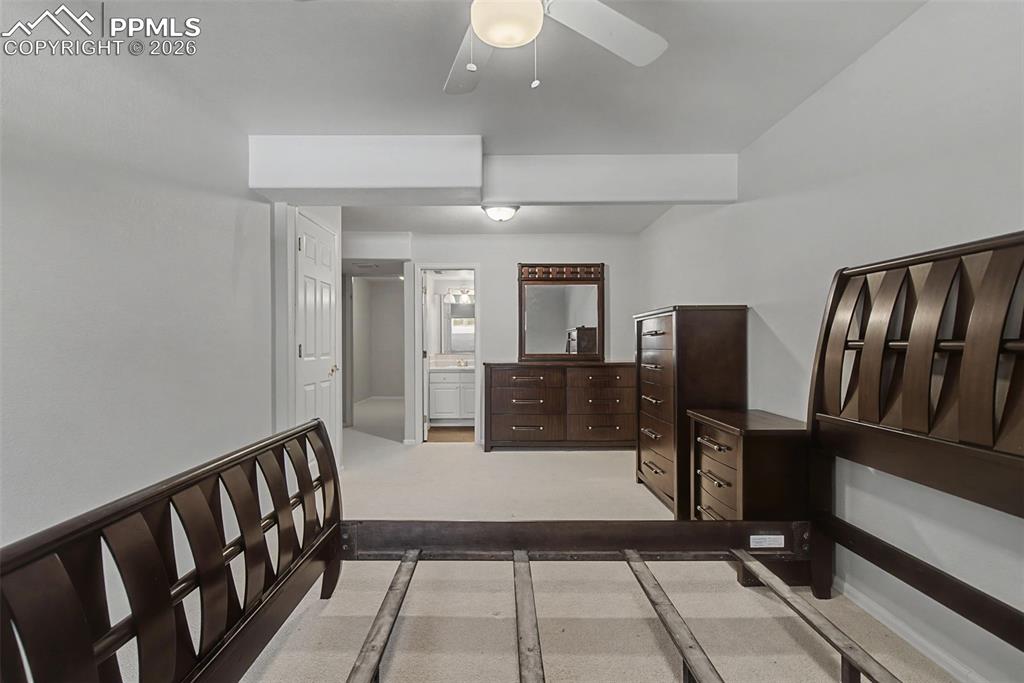 20 Luxury Lane Colorado Springs, CO 80921 - Photo 24 of 36 a living room with furniture a flat screen tv and a table