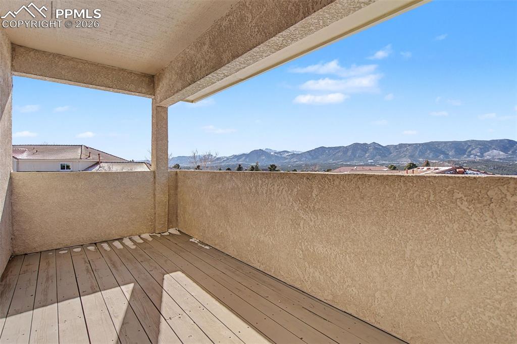20 Luxury Lane Colorado Springs, CO 80921 - Photo 33 of 36 a view of a terrace with wooden floor and a lake view