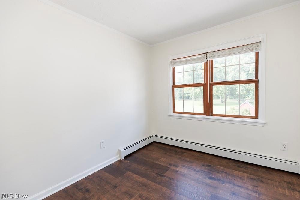 32618 Detroit Road Avon, OH 44011 - Photo 30 of 40 Wood-finish flooring, white walls, and a large window with grilles