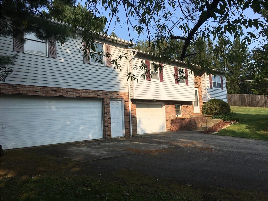Front of home with parking.