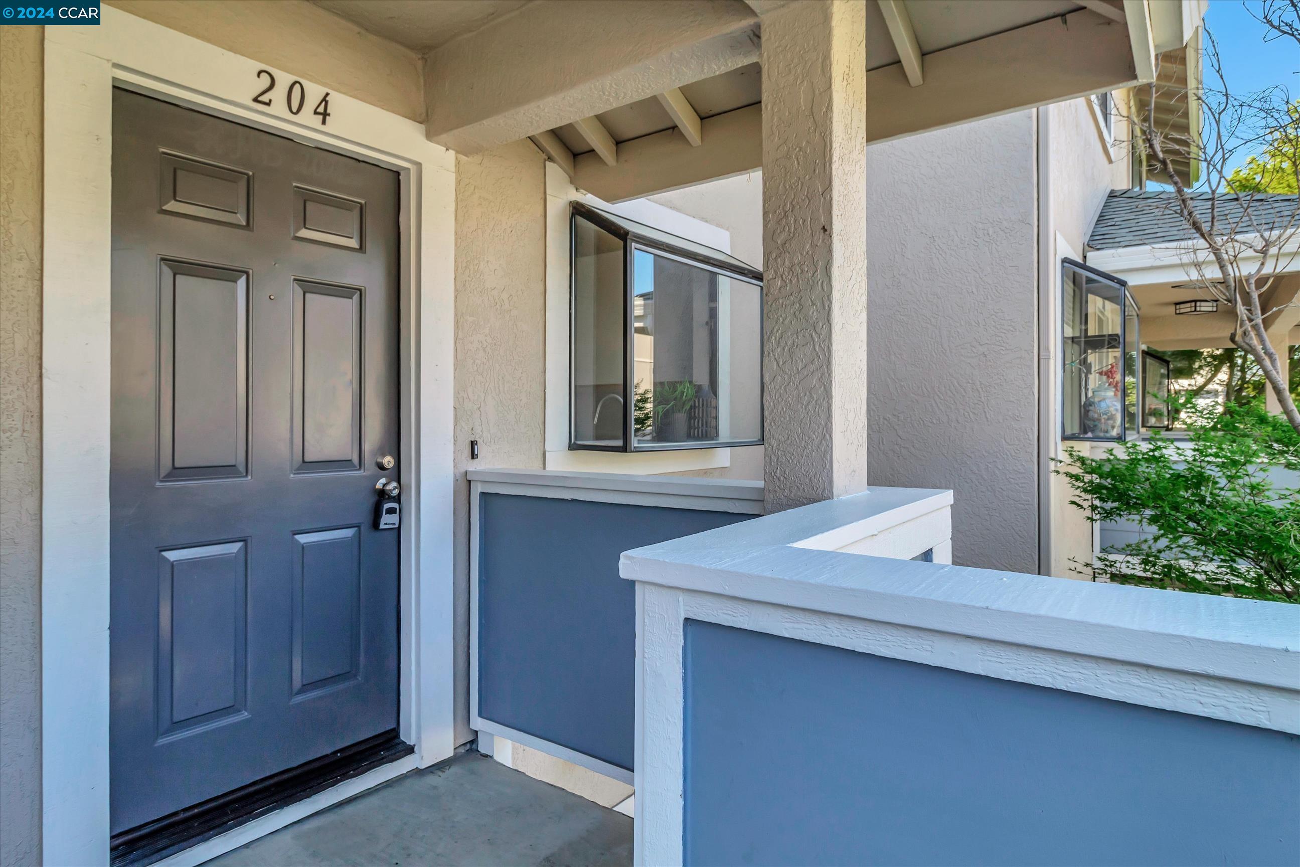 2677 Oak Road, Unit 204 Walnut Creek, CA 94597 - Photo 1 of 1 a view of front door of house
