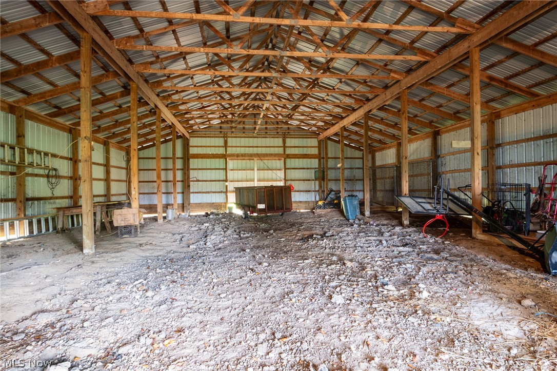 7005 Fee Road Rome, OH 44085 - Photo 29 of 36 Spacious open-span barn with exposed timber framing, metal roofing, and corrugated metal siding