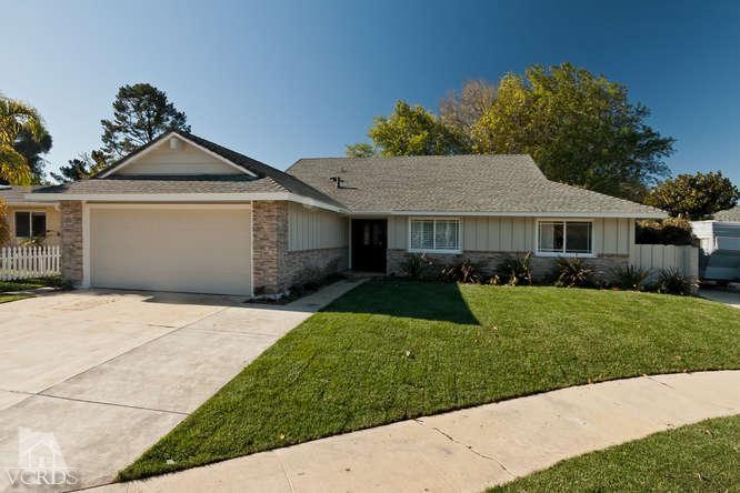 187 Kanan Road Oak Park, CA 91377 - Photo 2 of 20 a front view of a house with a yard and garage