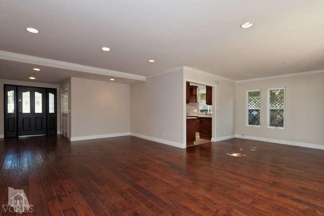 187 Kanan Road Oak Park, CA 91377 - Photo 12 of 20 a view of an empty room with wooden floor and a window