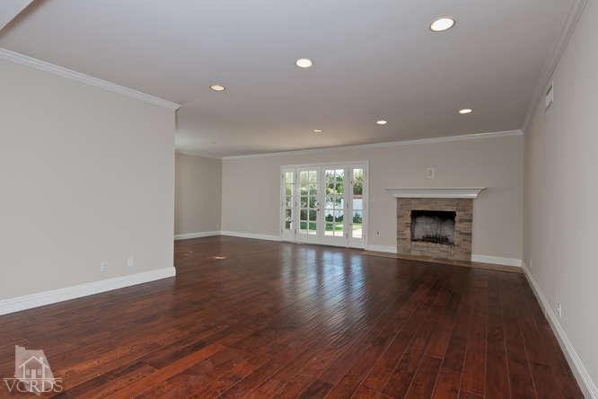 187 Kanan Road Oak Park, CA 91377 - Photo 13 of 20 a view of an empty room with wooden floor and a window