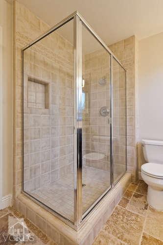 187 Kanan Road Oak Park, CA 91377 - Photo 15 of 20 a bathroom with a shower and toilet