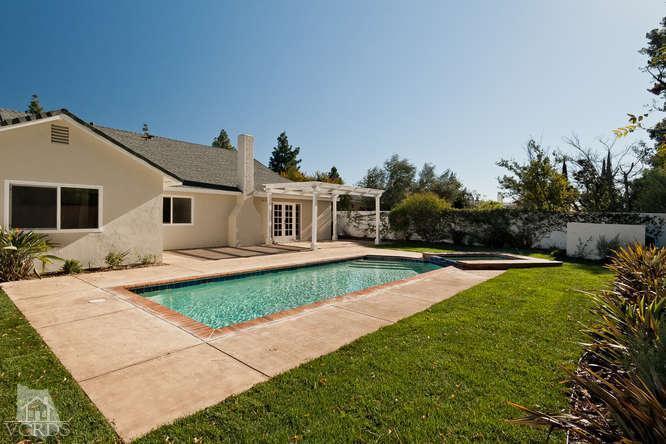 187 Kanan Road Oak Park, CA 91377 - Photo 4 of 20 a front view of a house with garden