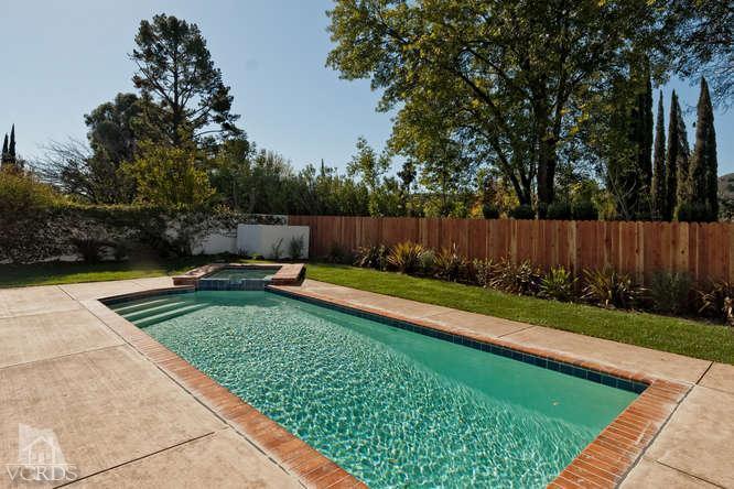 187 Kanan Road Oak Park, CA 91377 - Photo 5 of 20 a view of a backyard with a small pool